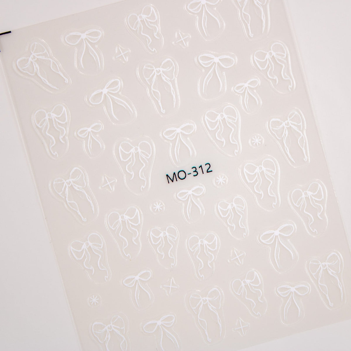 Sheet of classic white bow and ribbon nail stickers.