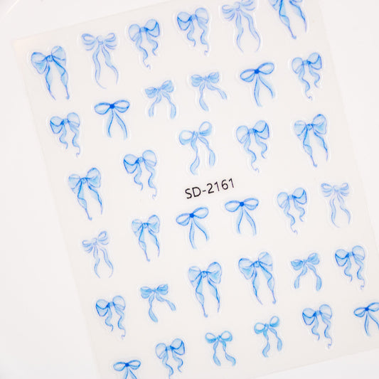 Sheet of dreamy blue bow and ribbon nail stickers.