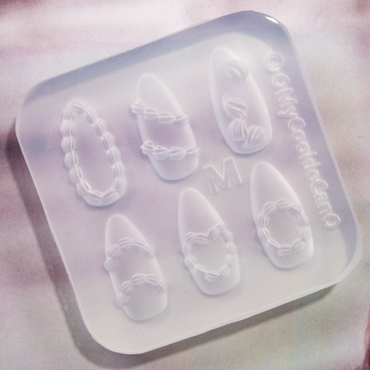 Close-up angled view of the clear silicone whipped cream mold.