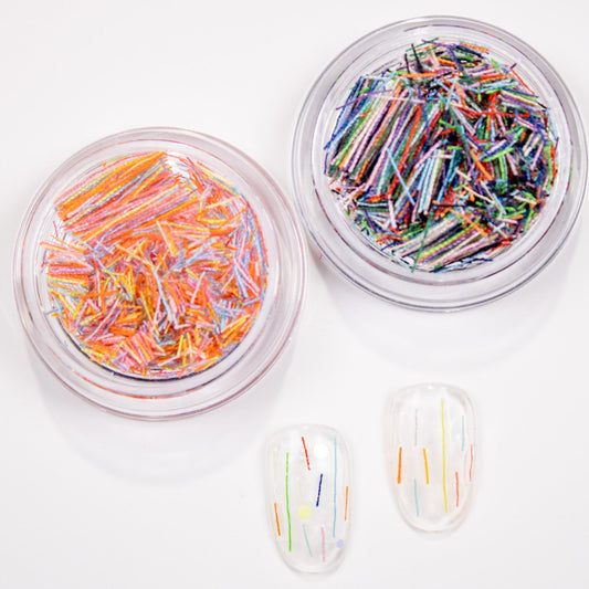Side-by-side view of Sweet Mix orange-blend and Dreamy Mix blue-blend candy strip sprinkles.