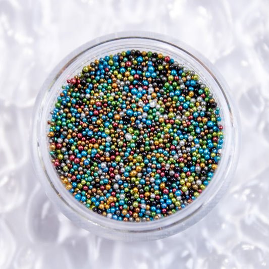 Top-down view of an open jar displaying tiny multicolor micro caviar beads.