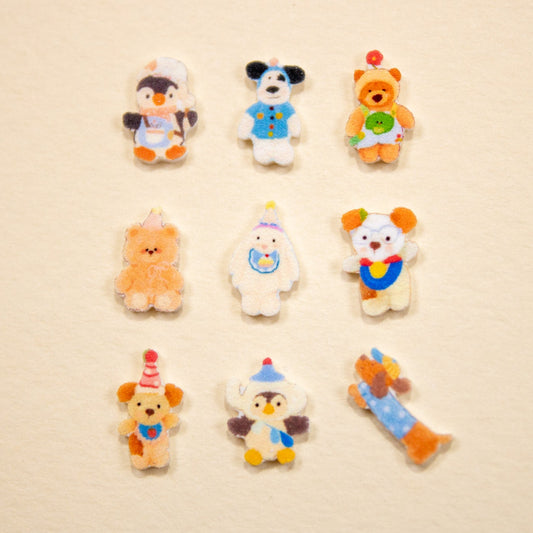 Grid display of assorted fuzzy animal 3D nail charms showing various bear, dog, and penguin character designs