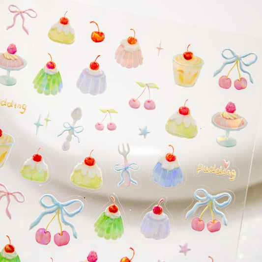 Close-up view of a sticker sheet packed with holographic jelly pudding and cherry nail art decals.