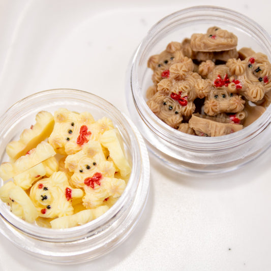 Open jars displaying 3D vanilla and chocolate cookie bear nail charms.