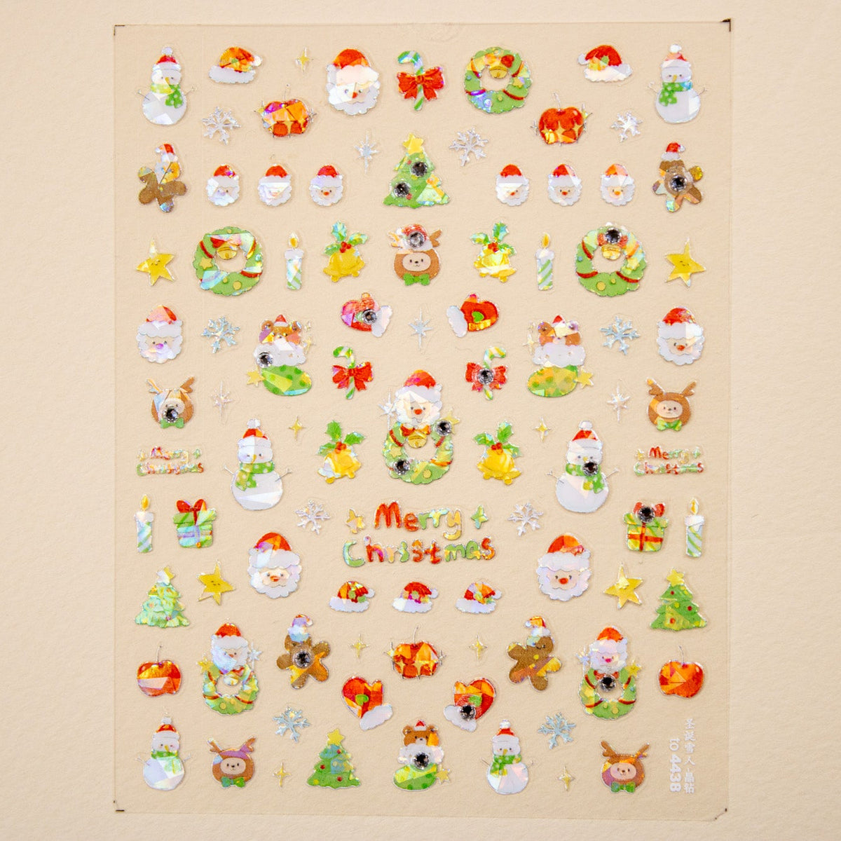 Full Holly Jolly Christmas nail sticker sheet laid flat at an angle displaying all available holiday decals and text elements.