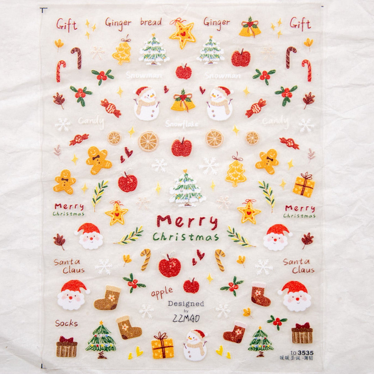 Full flat lay view of the Gingerbread Christmas Nail Sticker sheet on a light neutral background.