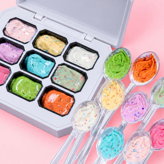 Open 9-color Whipped Sprinkle Gel Palette next to clear nail swatch sticks topped with scoops of colorful gel.
