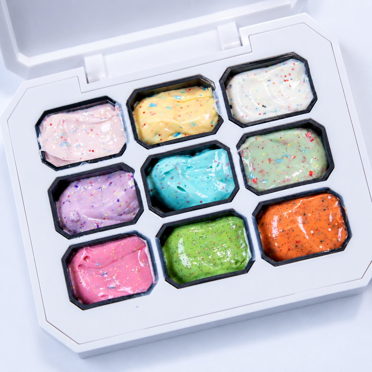 Top-down view of the open 9-compartment Whipped Sprinkle Gel Palette.