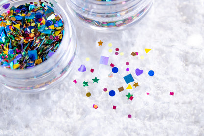 Confetti nail glitter mix with colorful shapes for creative DIY nail art.