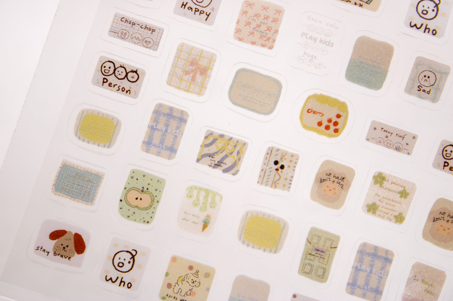 Cute doodle nail decals with plaid patterns, hearts, flowers, and minimalist hand-drawn nail art designs.