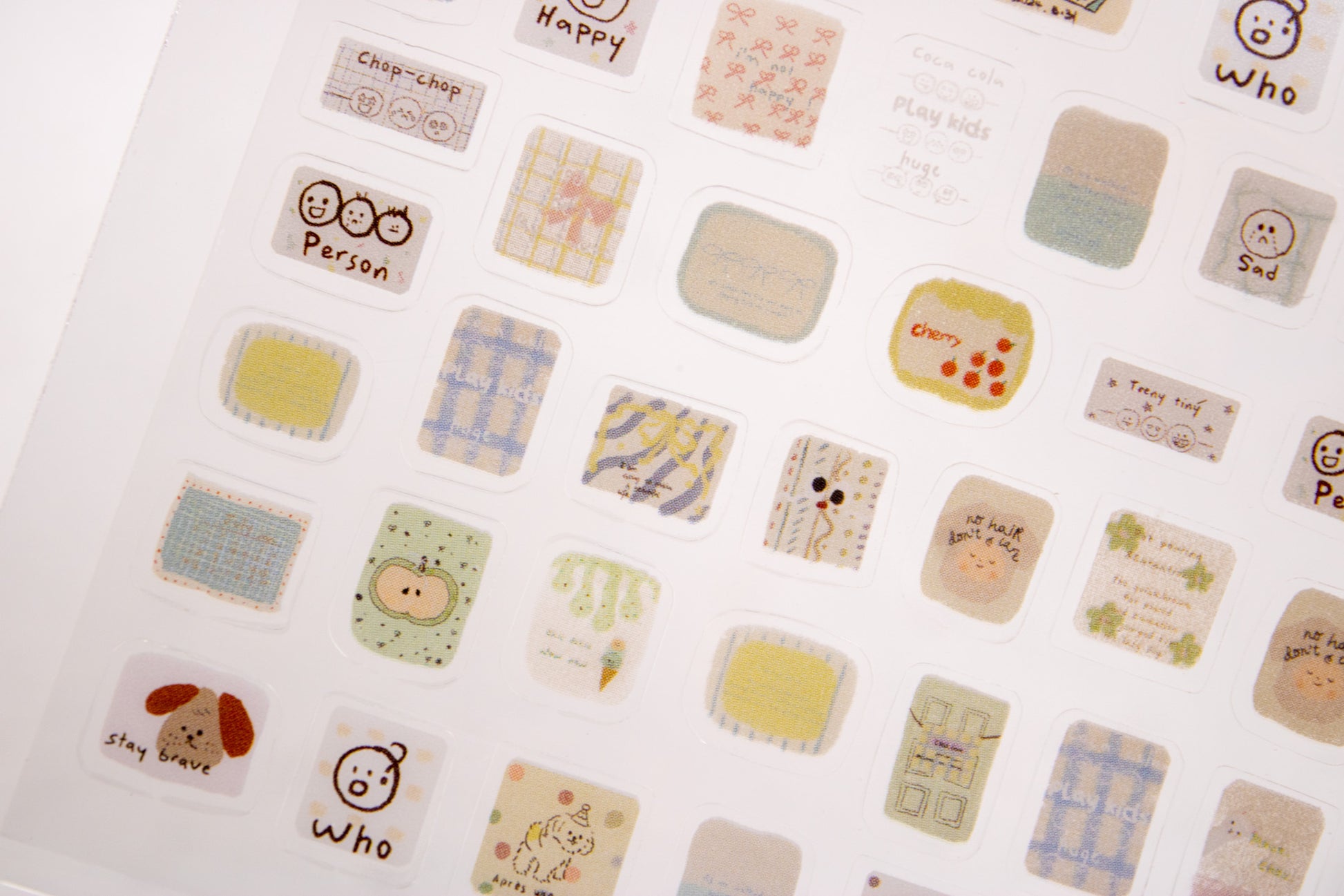Cute doodle nail decals with plaid patterns, hearts, flowers, and minimalist hand-drawn nail art designs.