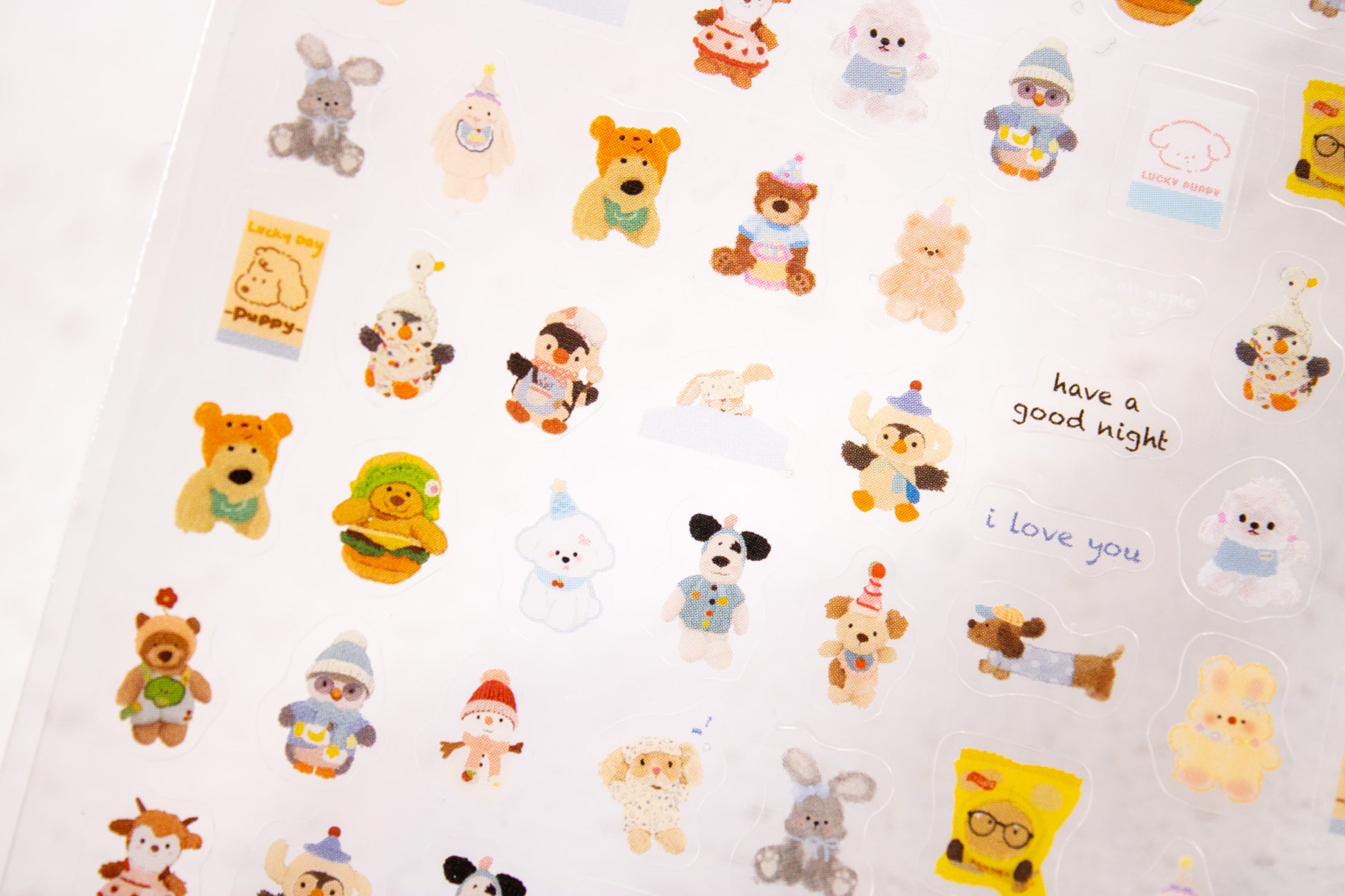 Kawaii animal nail decals with puppy, bunny, bear, and lamb designs.