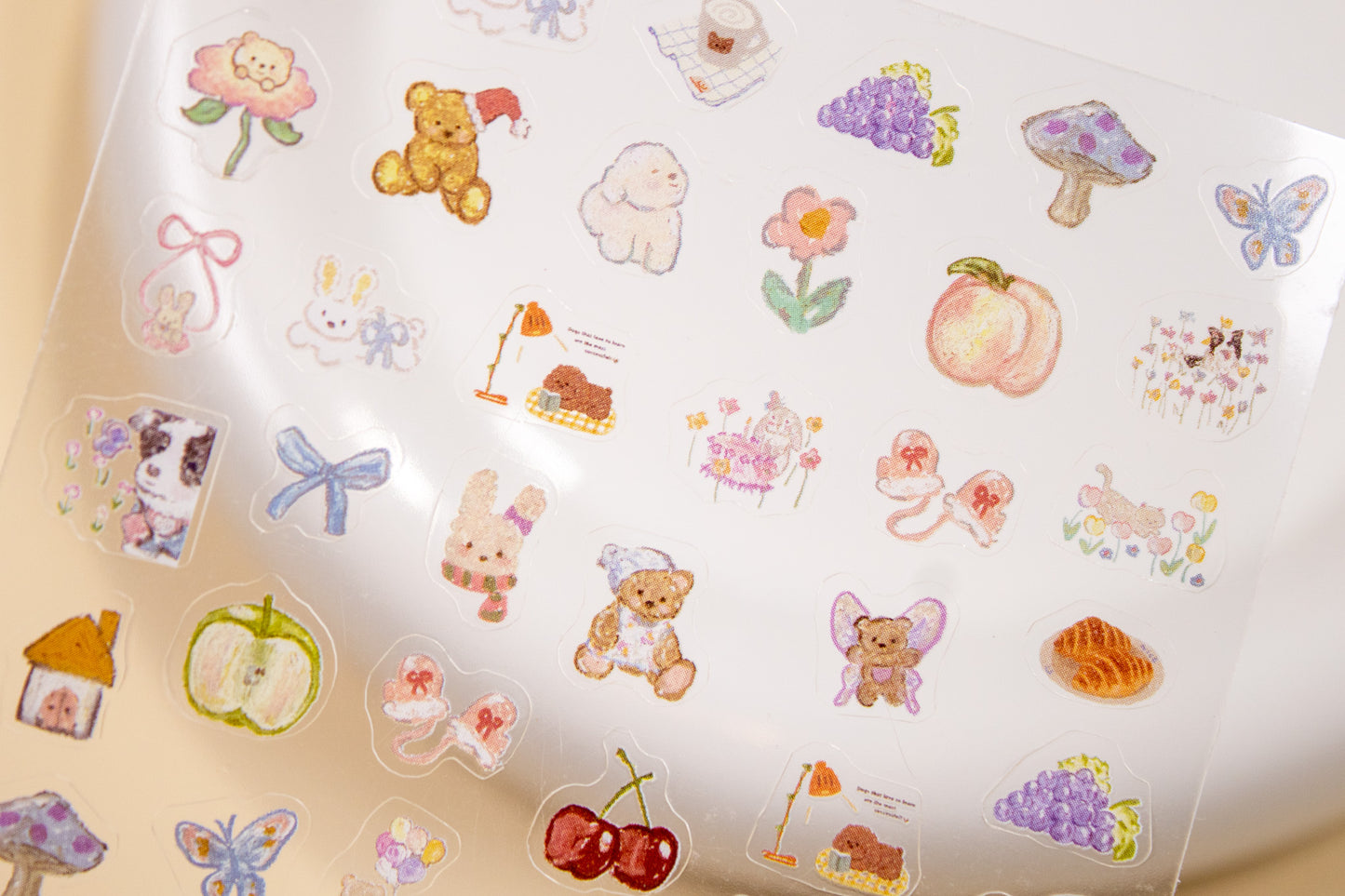 Kawaii bear and bunny cottagecore nail stickers with fruit, ribbons, and picnic illustrations.
