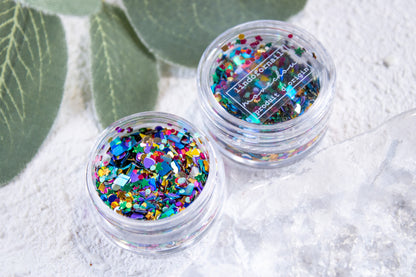Kitsch confetti nail mix in a jar with colorful shapes for nail decorations.