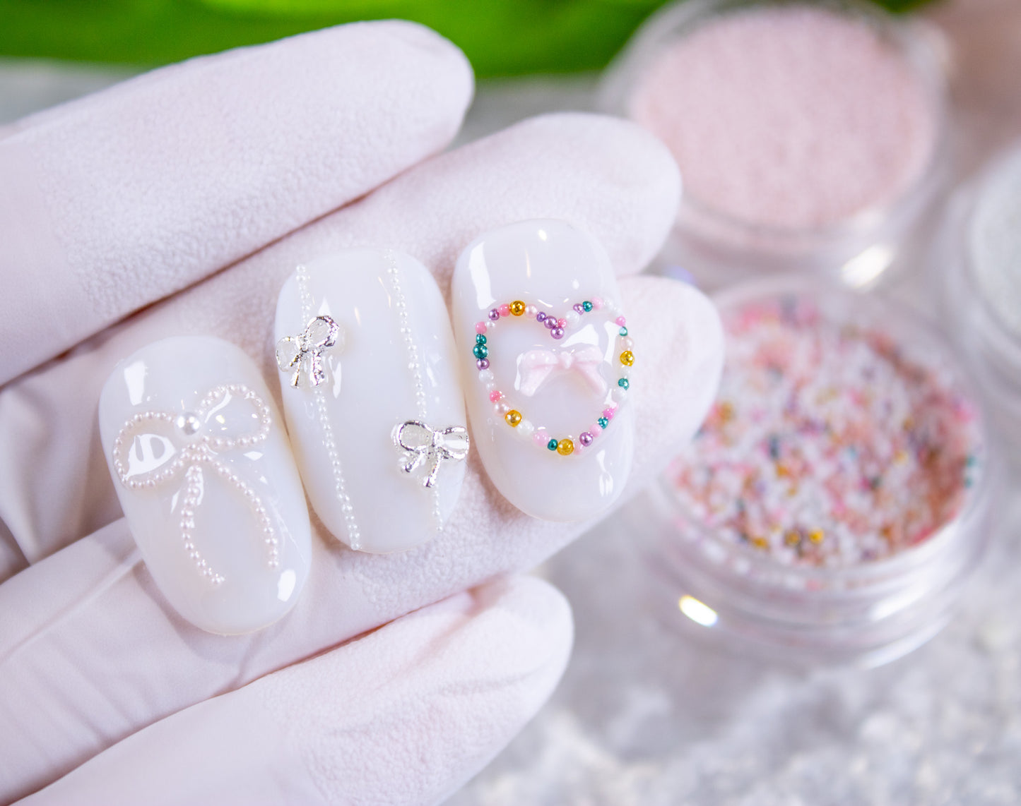 Tiny pearl beads used to create bows and accents on gel nail designs.