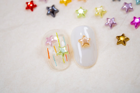 Y2K star nail charms used on gel nail design for colorful star nails.