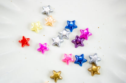 Small colorful Y2K star nail decorations for kawaii nail art.